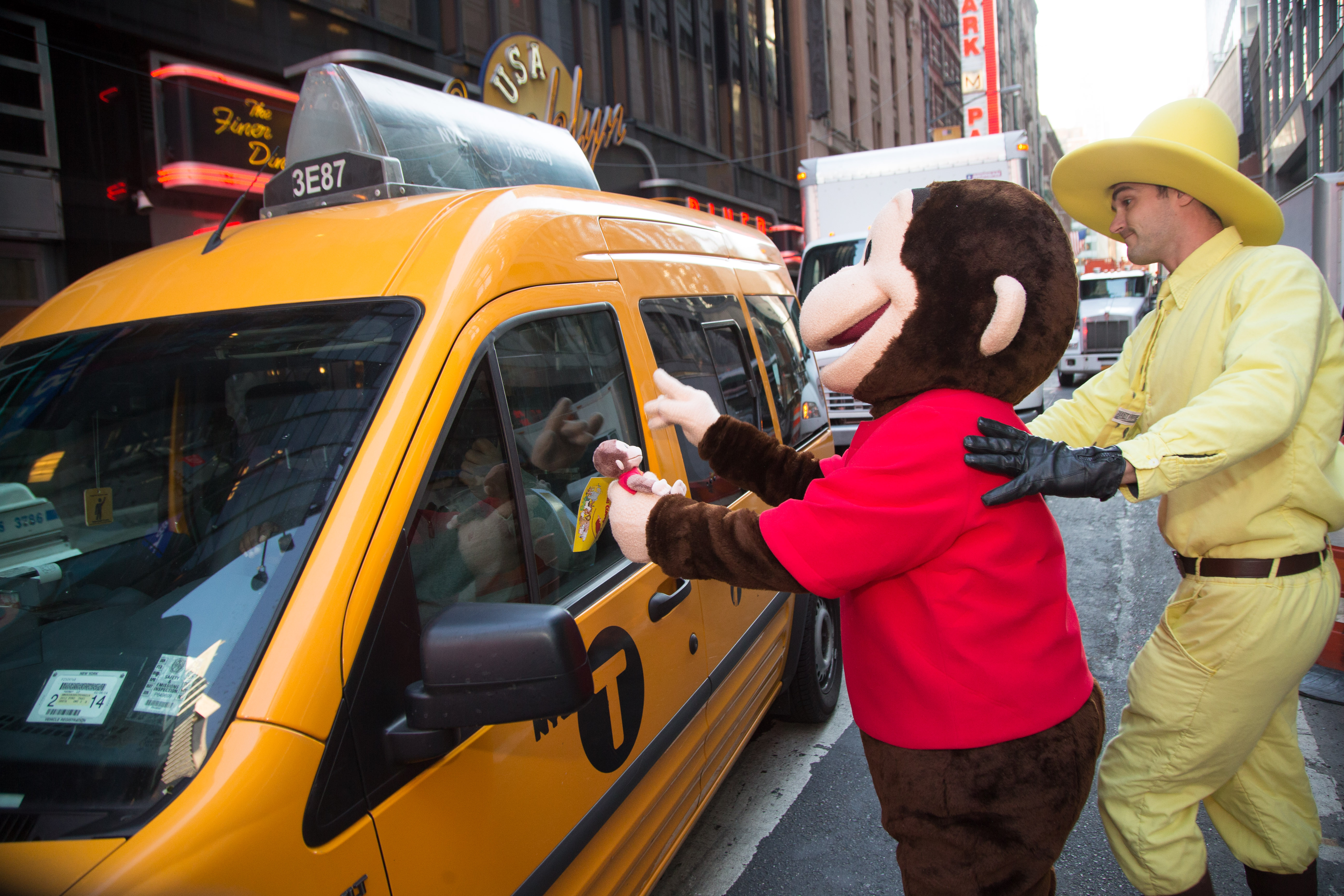 2013 IPO at Times Square. Curious George and The Man With the Yellow Hat